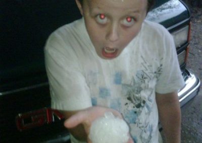 Kid Amazed By Huge Hailstone