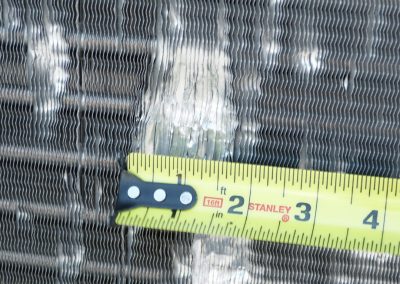 Macro Of Measuring Tape Near Damaged HVAC