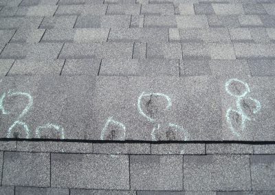Multiple Circle Markings On Shingle Roofing